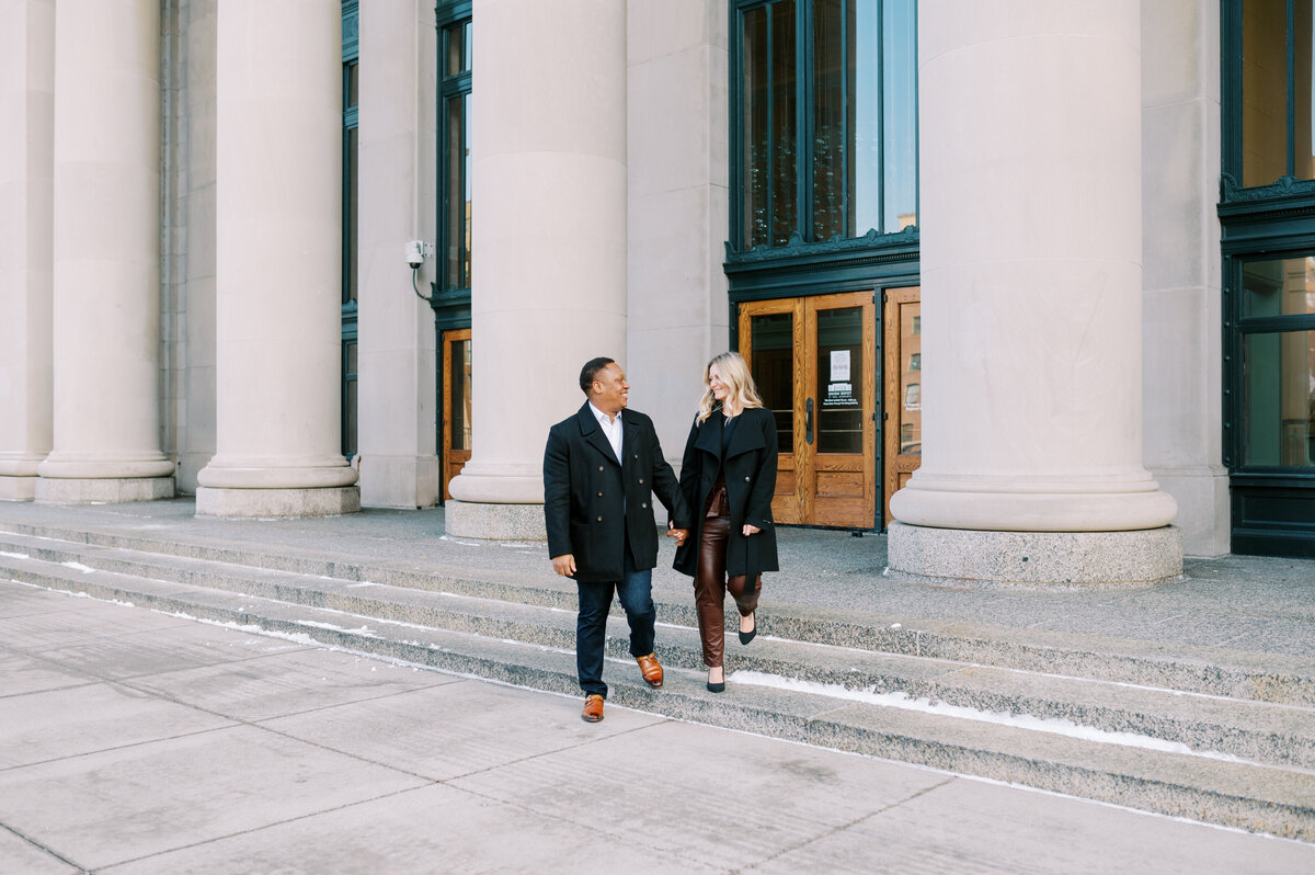 Couple walking down steps at Union Depot St. Paul, MN