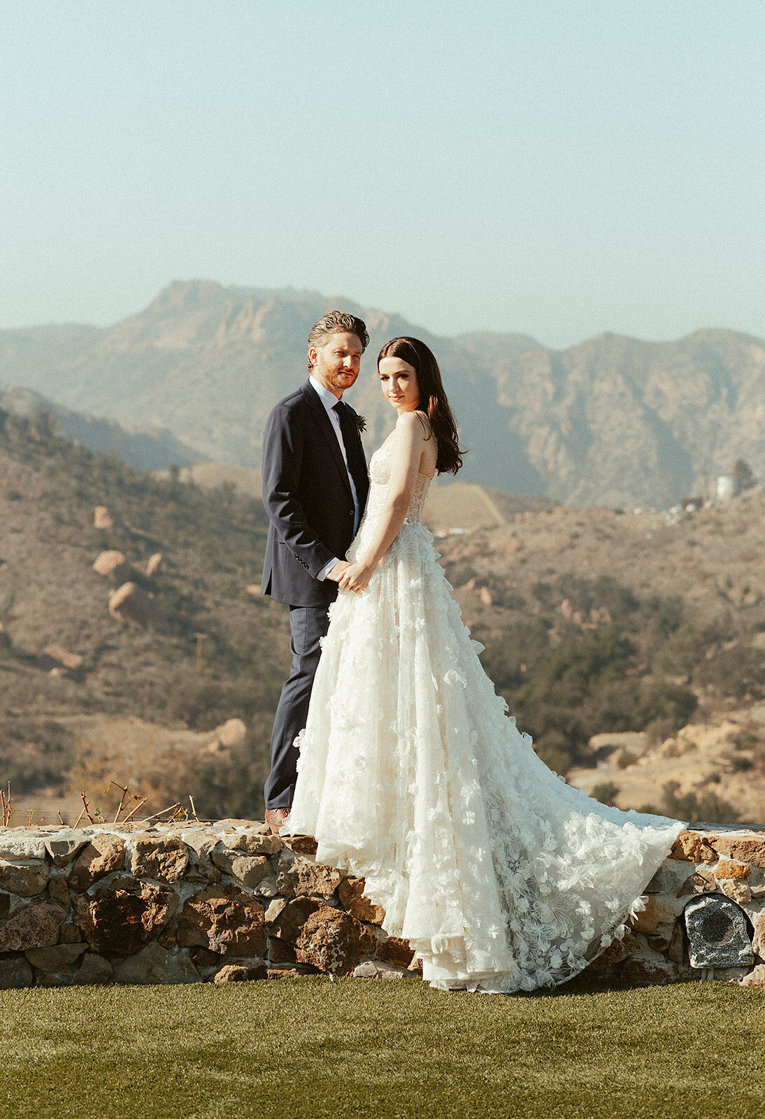 bride and groom photo with mountain backdrop