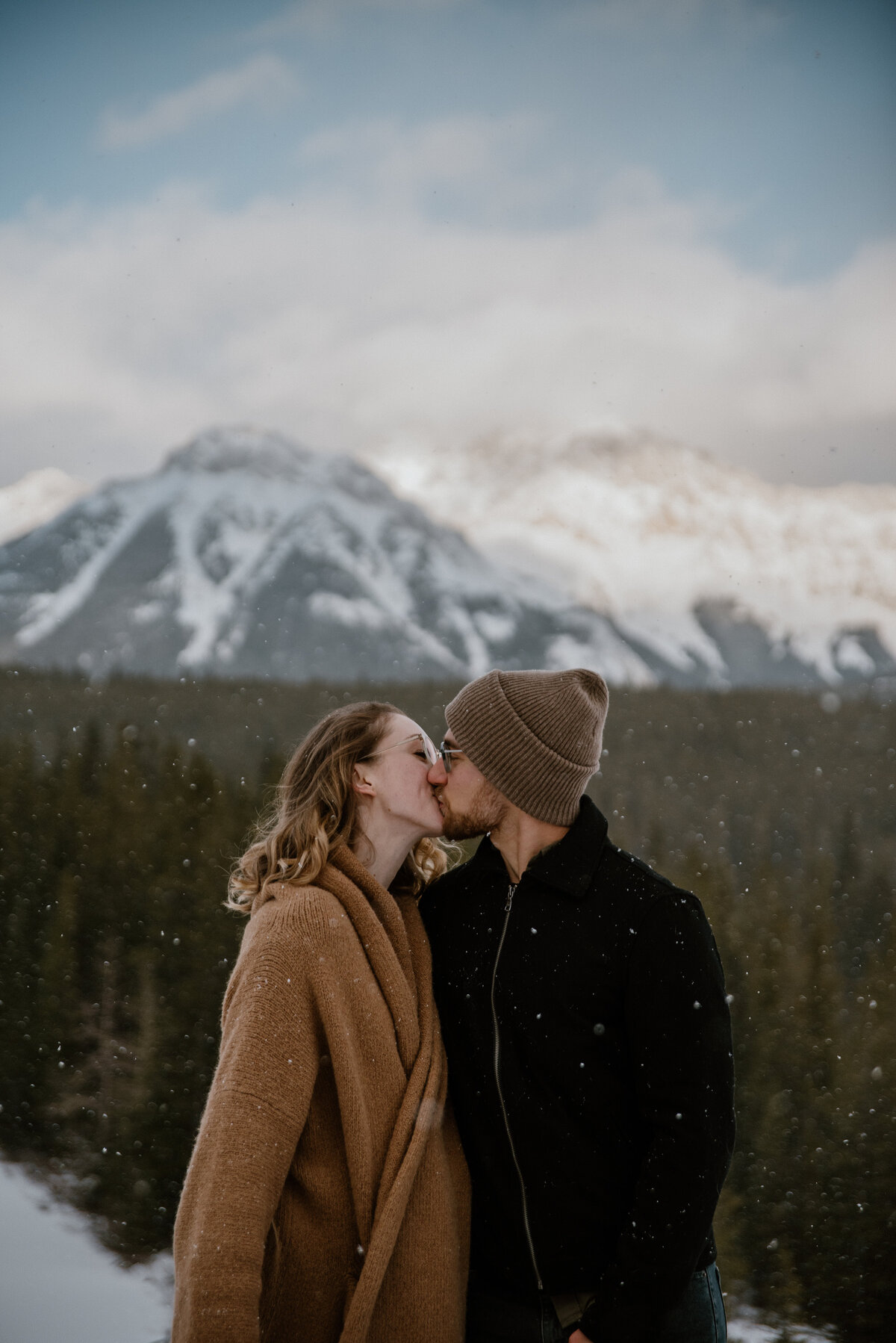 winter couple engagement session in the mountains