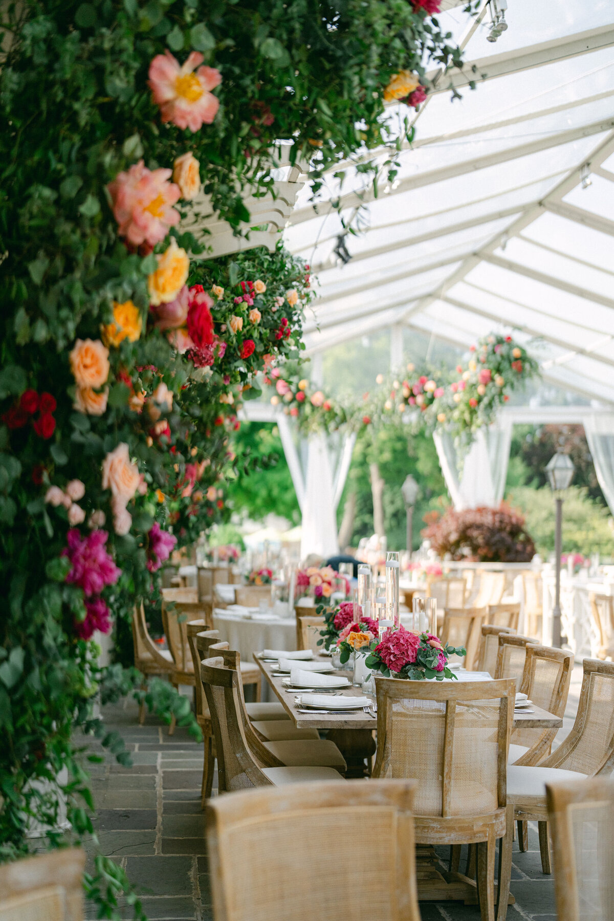 Close-up view of the floral arrangements and table setting at Saddle Country Club.