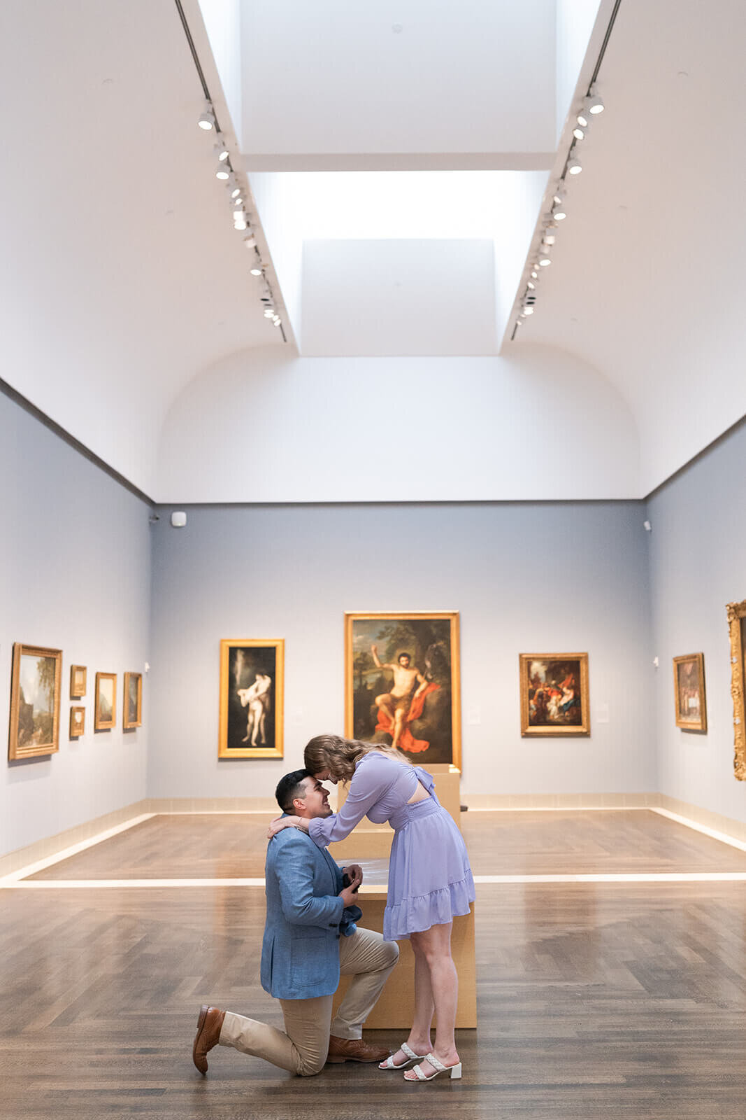 Torontos best wedding photographers Swish and Click Photography couples marriage proposal at museum of fine arts