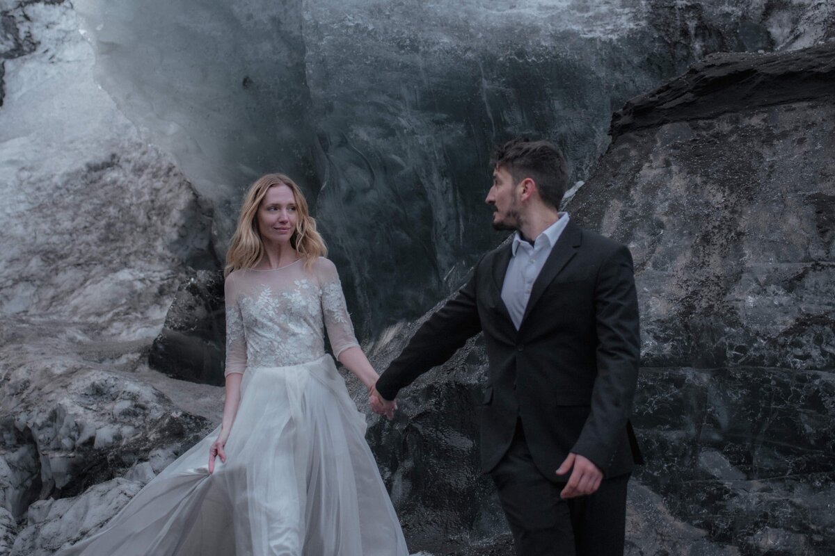 Destination wedding portrait in Iceland ice cave edited with Mellow Light preset – cool tones, moody highlights, and film-inspired depth for elopement photographers.