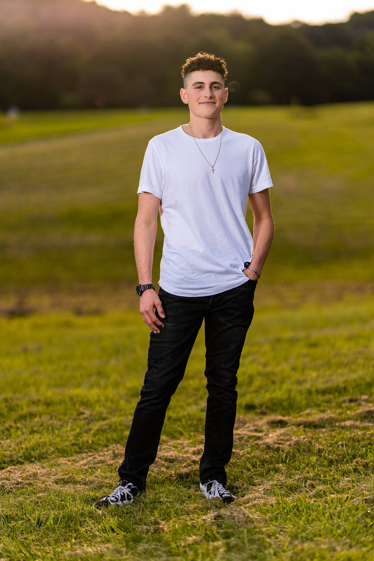 Pittsburgh senior photo of a senior standing in a field at brush creek park, beaver county PA. Captured by Michael Fricke Photography, a Pittsburgh Senior Photographer