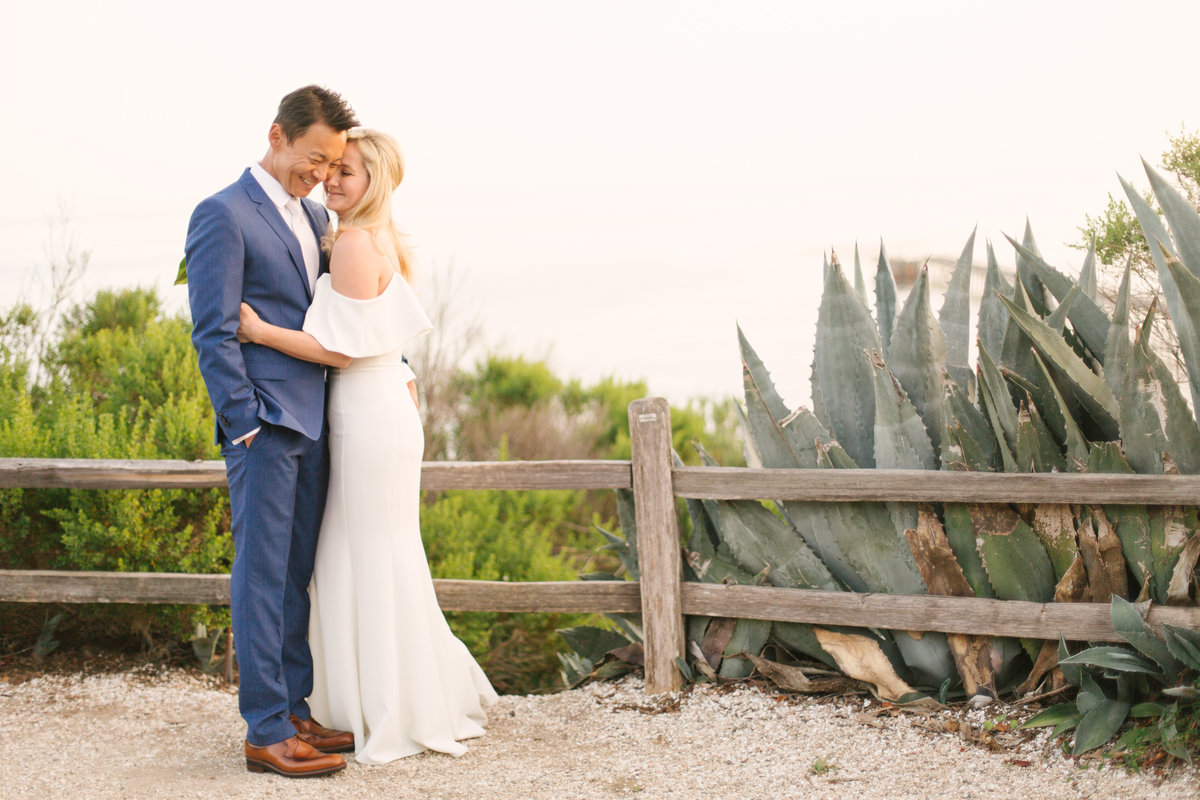 Jae and Sue cuddle after Bacara Resort elopement