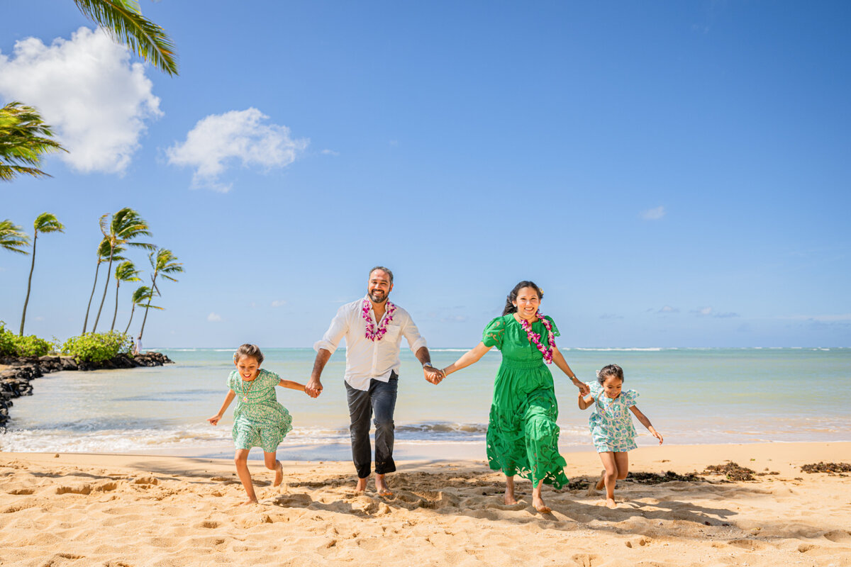 Hawaii family vacation photographers capturing authentic moments on tropical beach - professional island travel photography
