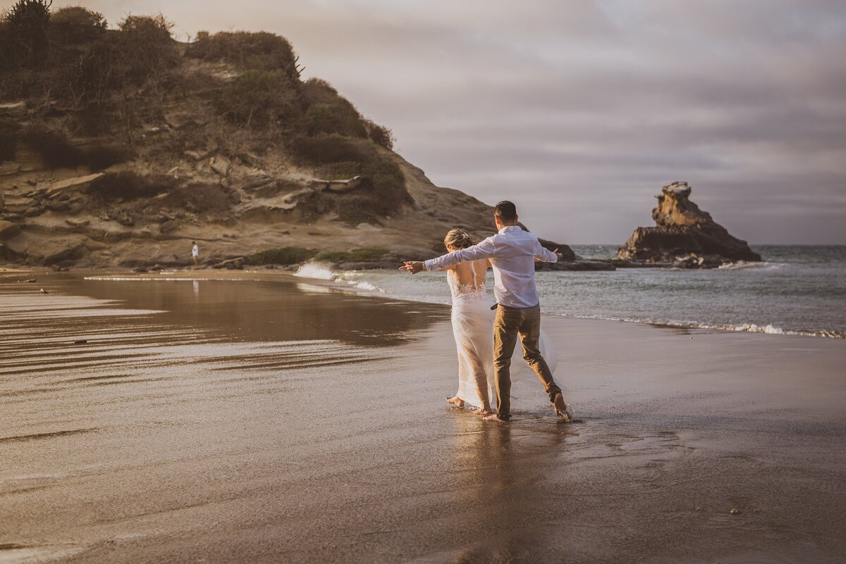 the sea and wedding couple walking in the water of the sea - Happiness