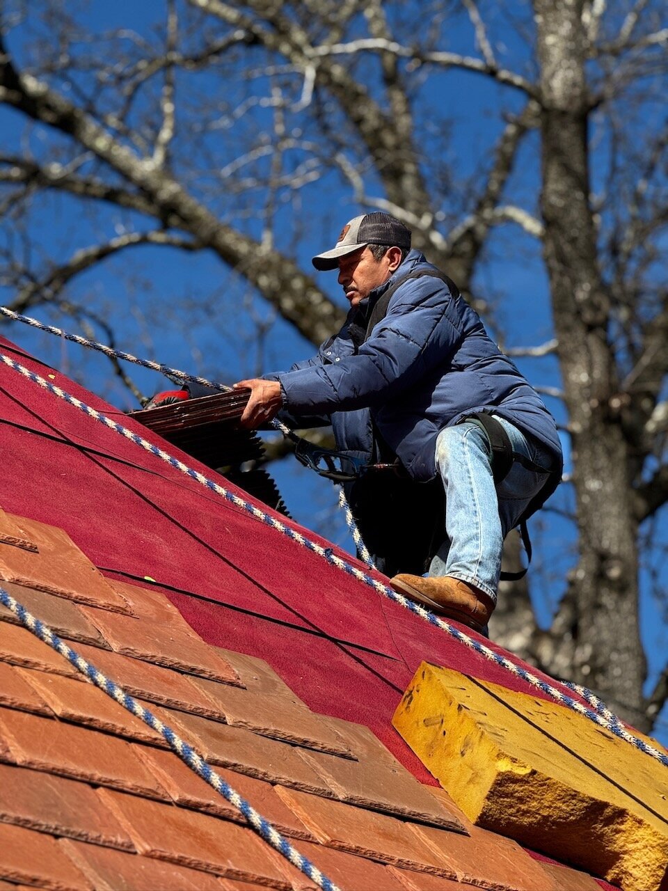 roof-installation-crew-working-red-roof-better-lawns