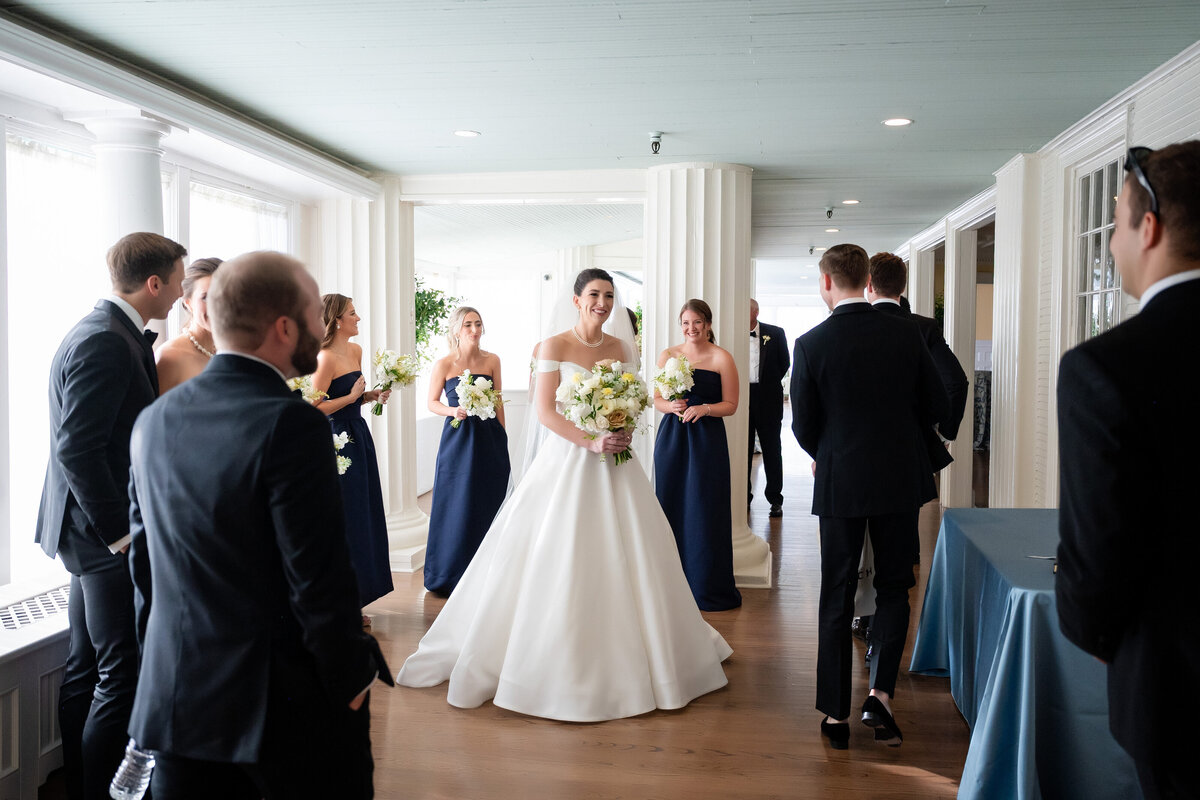 candid photo of a bride and family hanging out inside of the pittsburgh golf club