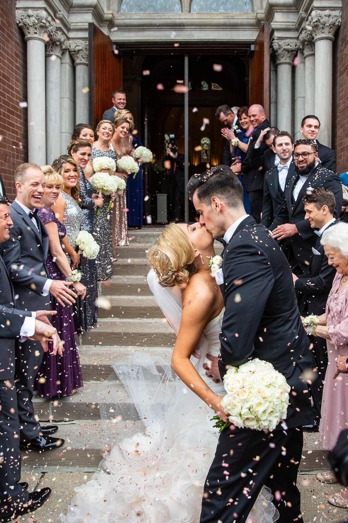 A confetti exit for the bride and groom at a church.