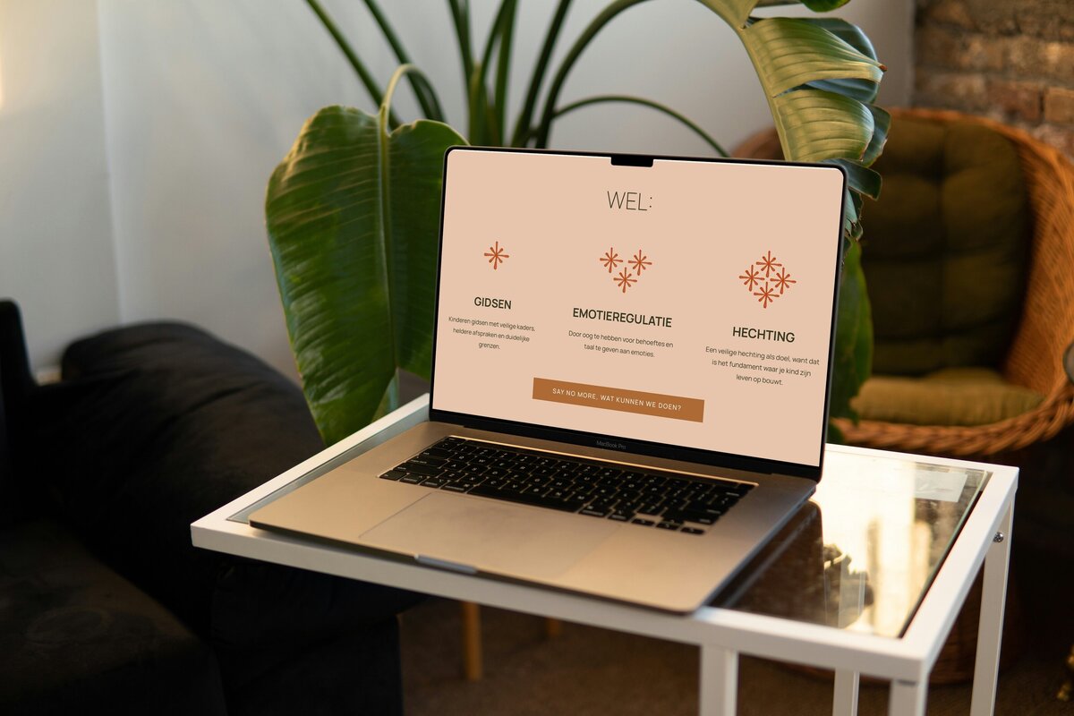 Free MacBook Pro on Small Table Mockup