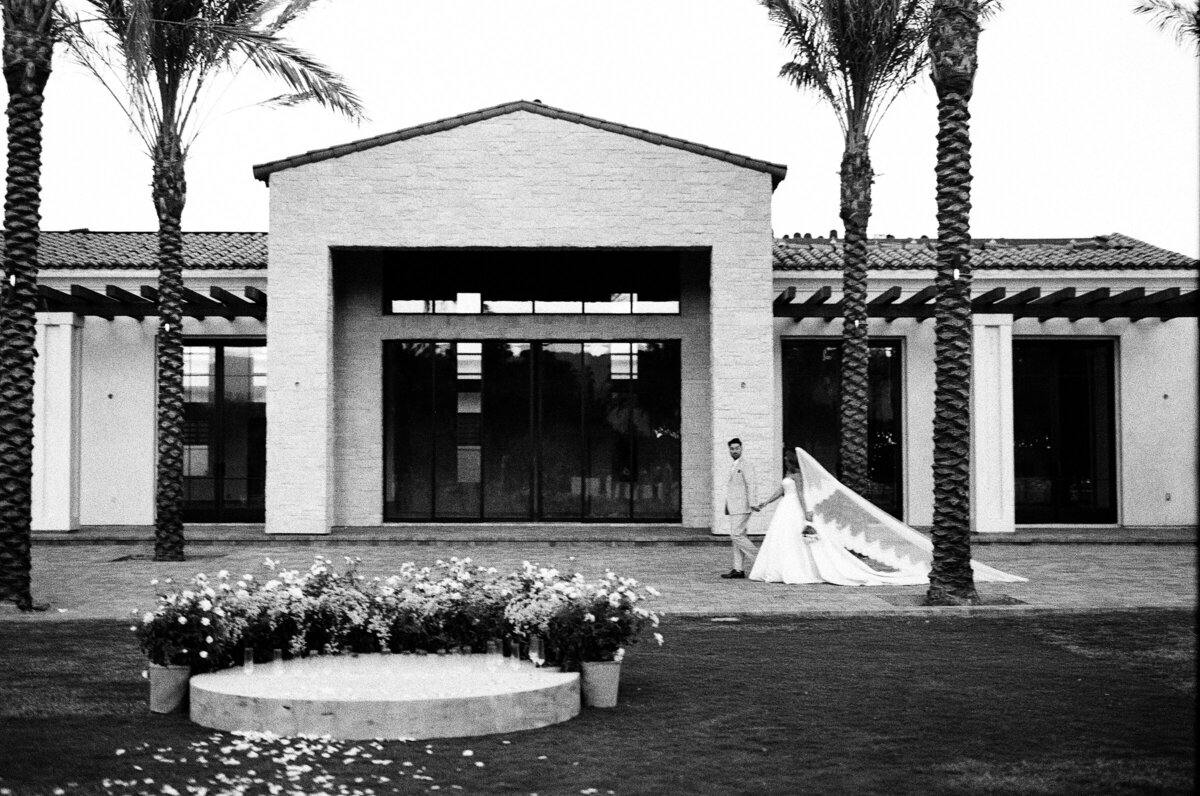 bride and groom walking black and white 35mmfilm Cache Estate