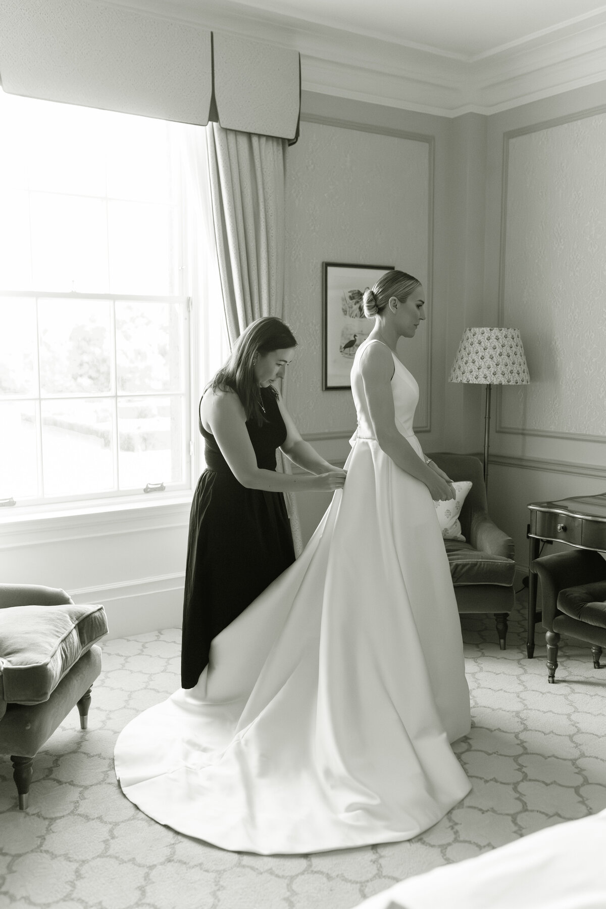 Melanie of MHM Styling assists a Bride on the morning of Gleneagles wedding day.  Image by editorial wedding photographer, Jill Cherry Porter.