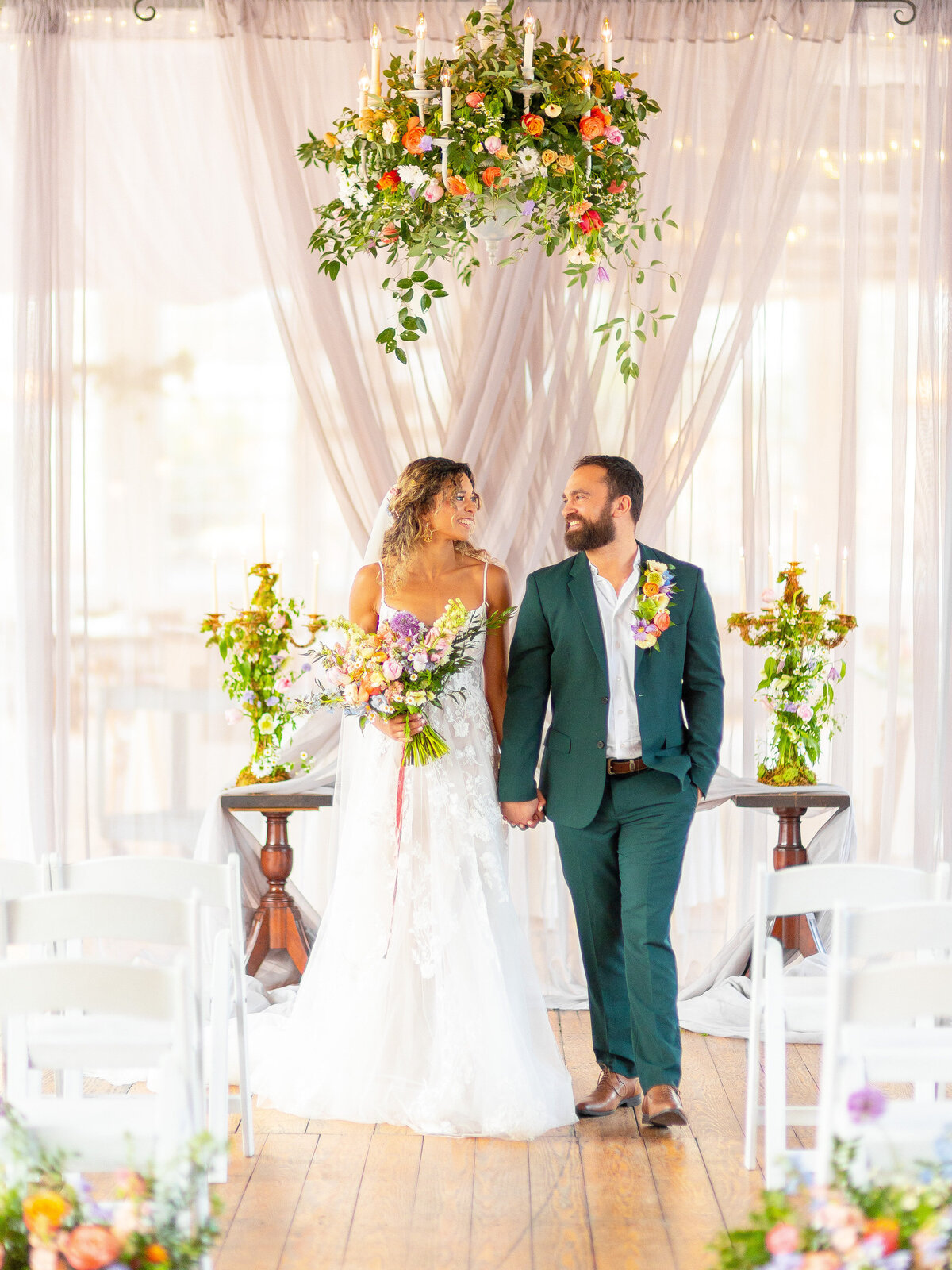 Bride and groom walking down  aisle