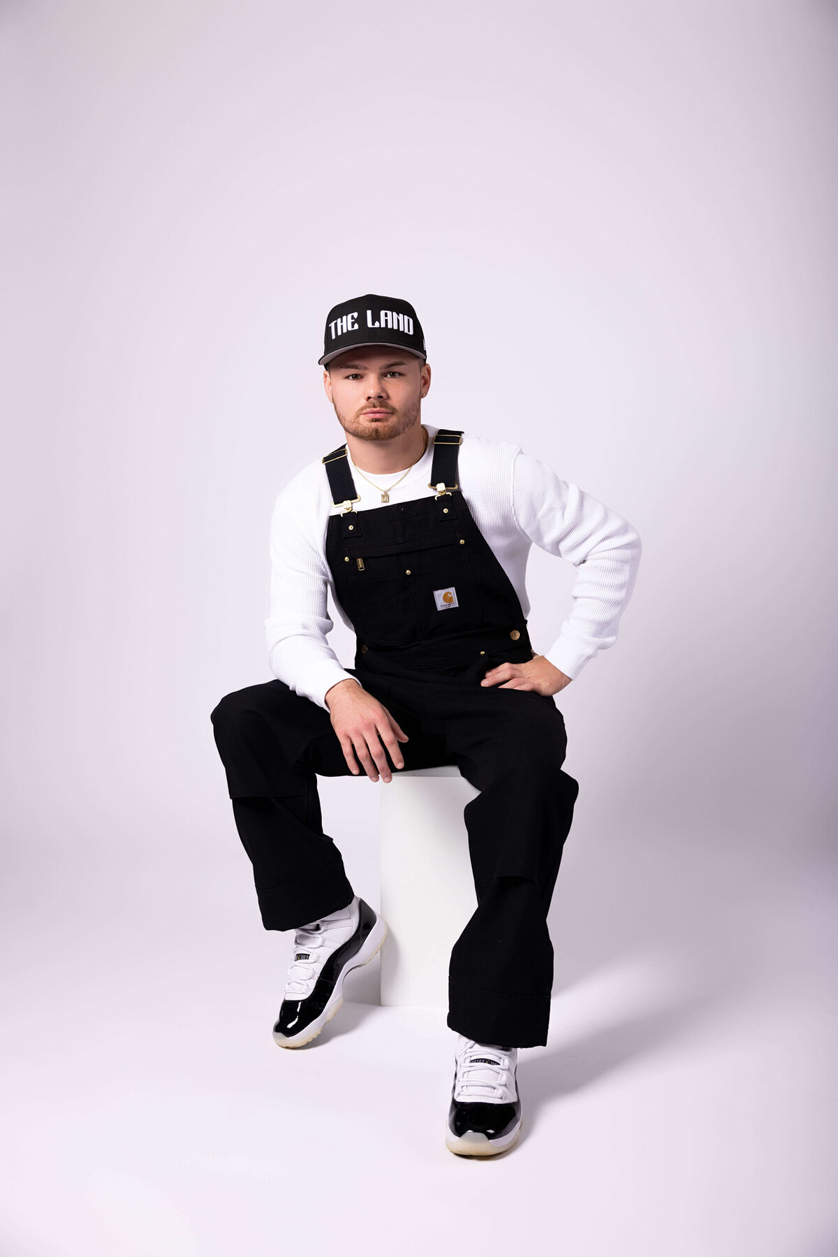 Professional boxer sitting on a box in birthday session with Reva Davis photography