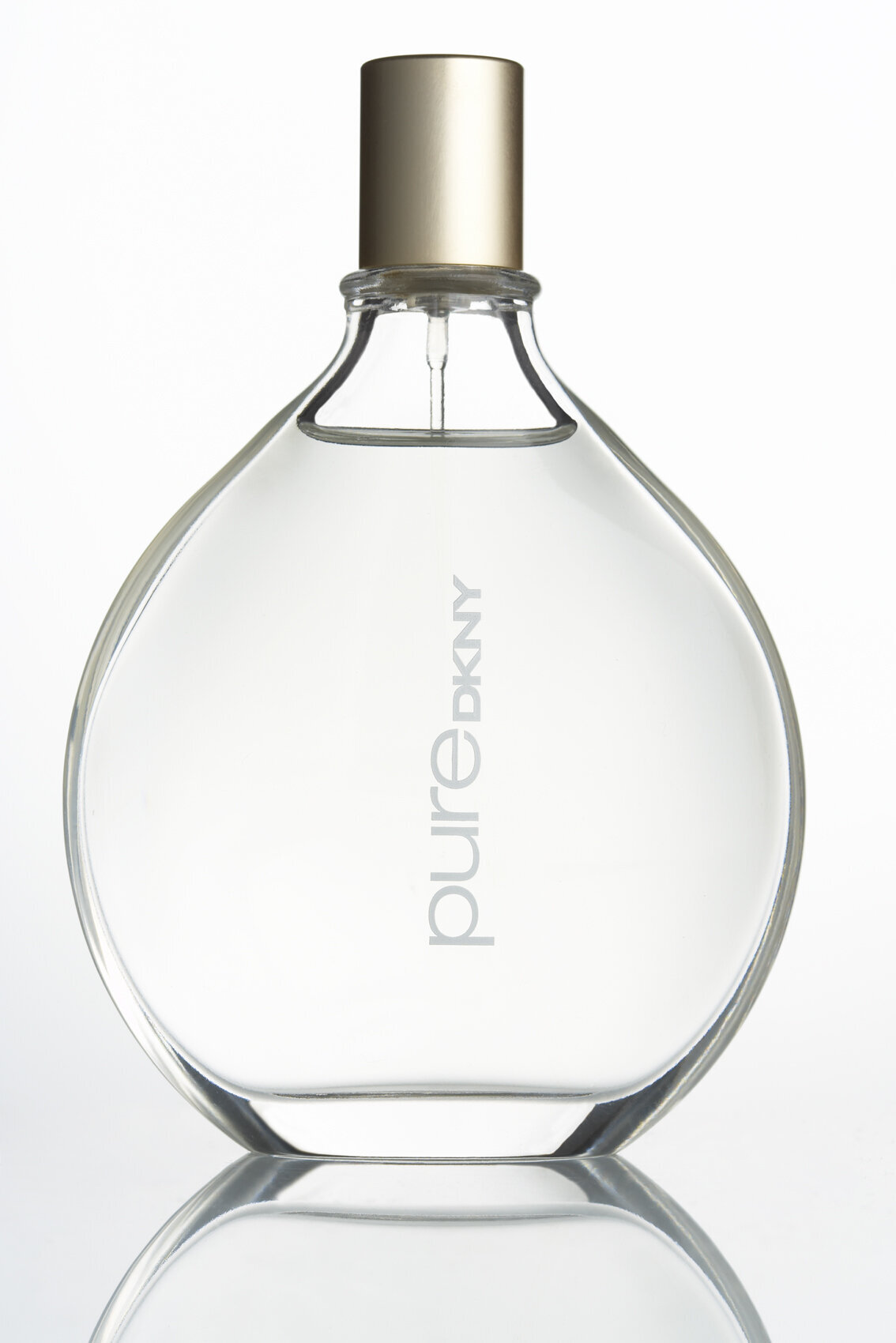 Minimalist bottle of Pure DKNY perfume with a delicate design, photographed by Ylva Erevall.