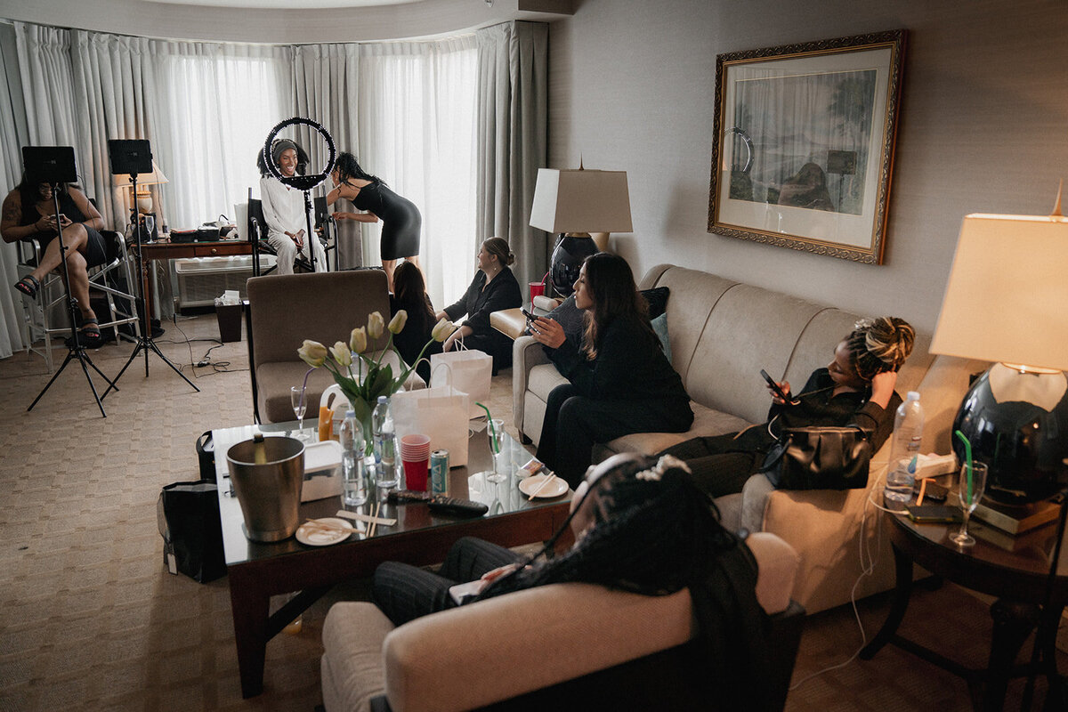black wedding party getting makeup done