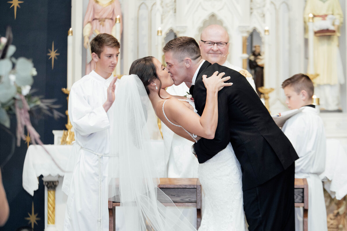 Big kiss during wedding ceremony. 