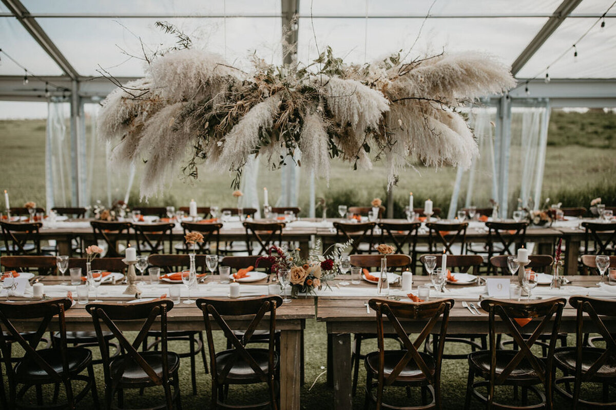 Tented wedding reception at The Gathered, a nostalgic greenhouse based in Kathryn, Alberta wedding venue, featured on the Brontë Bride Vendor Guide.