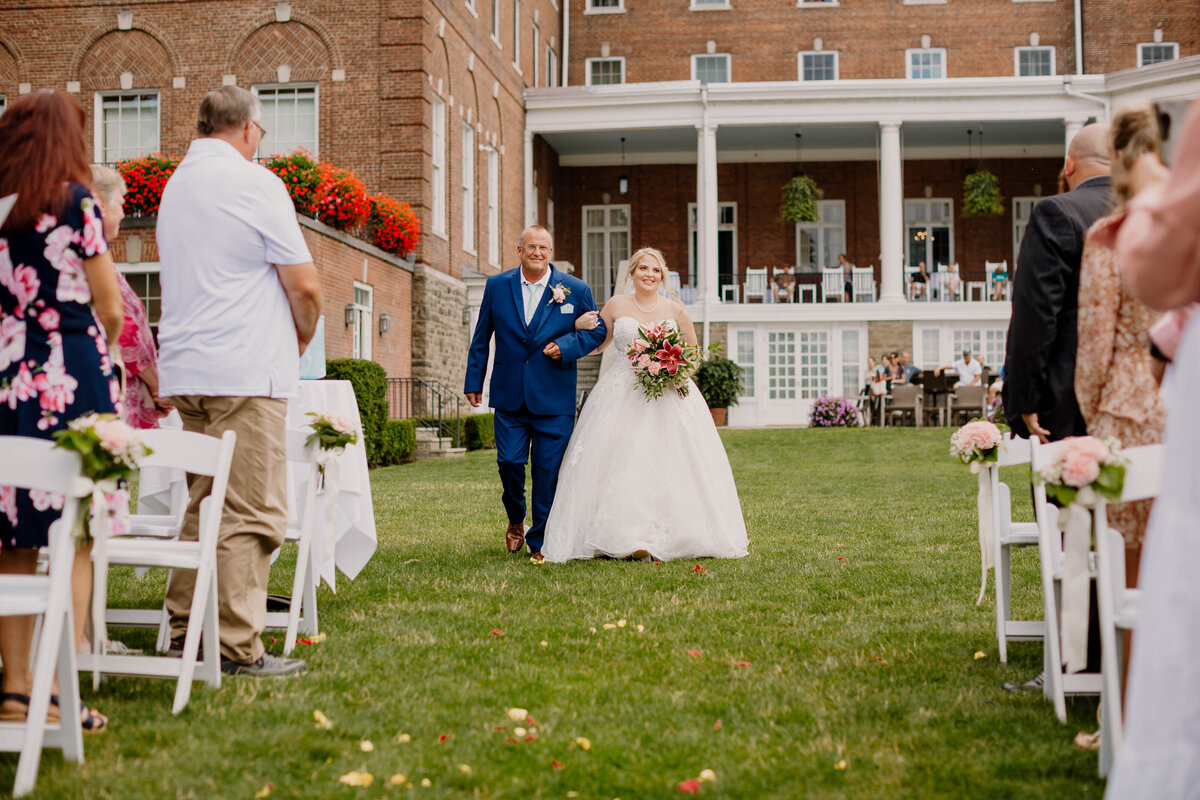 Wedding Photographer Cooperstown NY, Bride and Father walking down isle at Otesaga Hotel