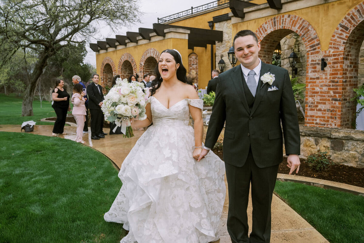 excited-couple-leaving-ceremony