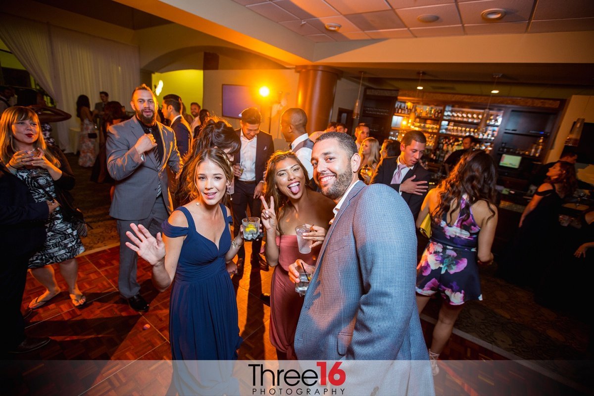 Wedding guests enjoy themselves on the dancefloor