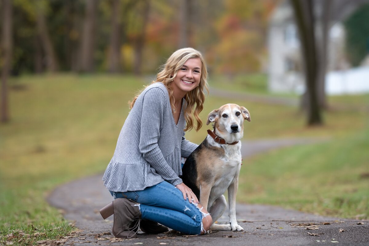 senior girl posing with dog