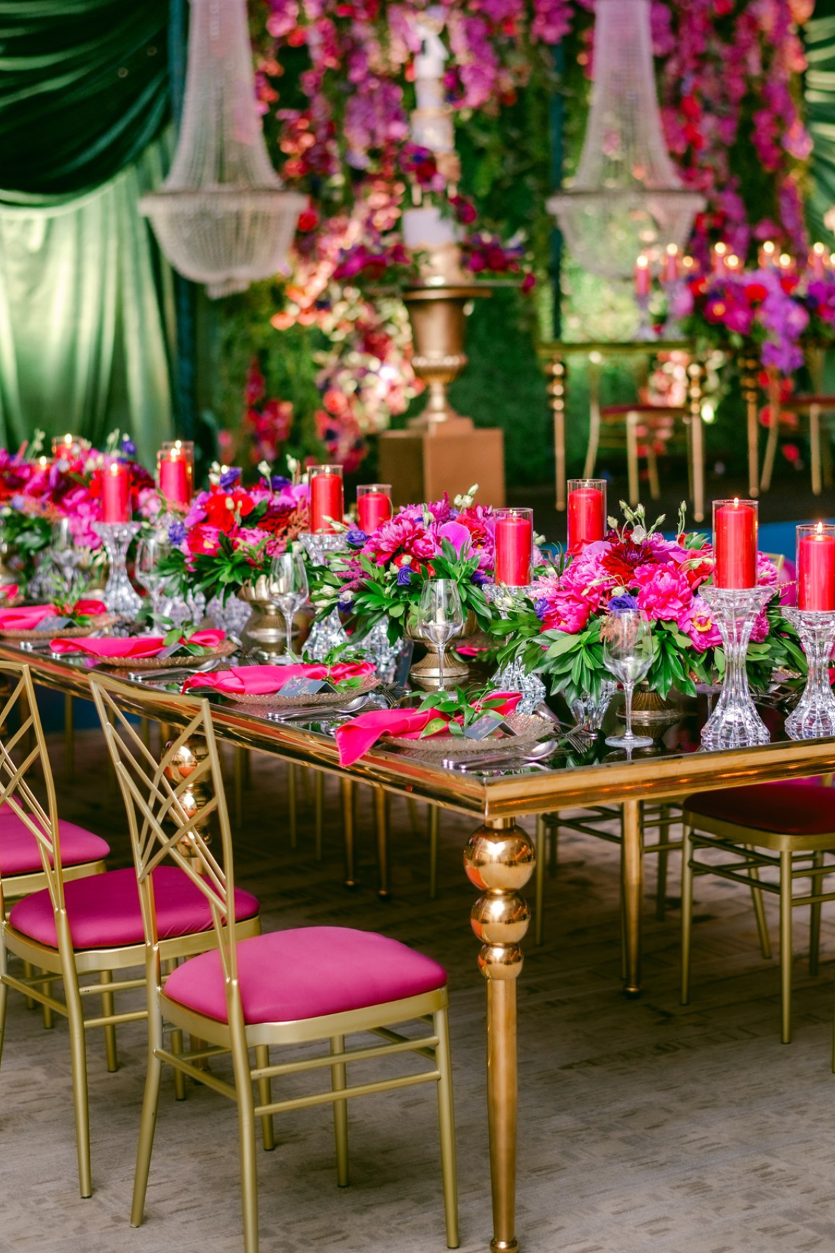 secret-garden-wedding-reception-greenery-pink-purple-gold-chairs-table-chandeliers
