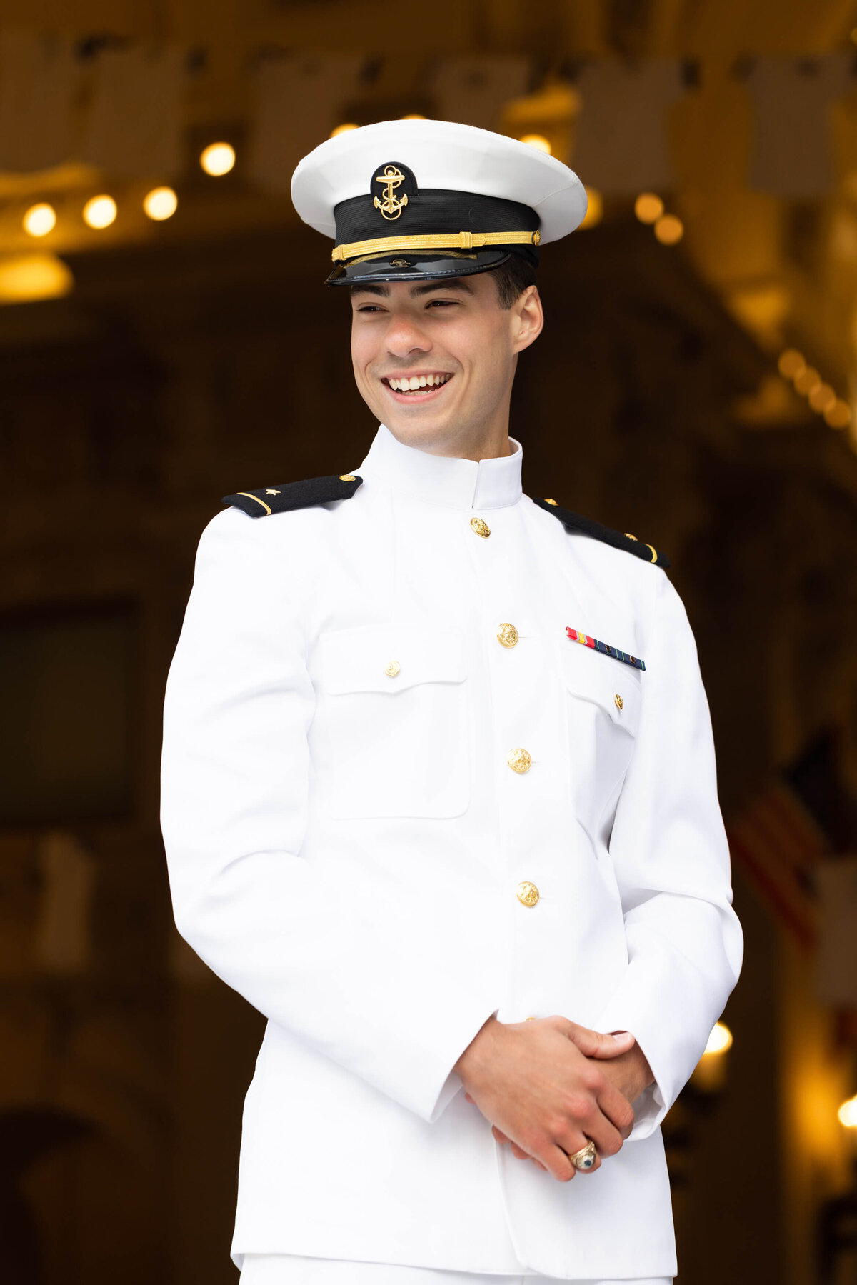 Midshipman laughing during a senior photography session with Kelly Eskelsen in Annapolis, Maryland.