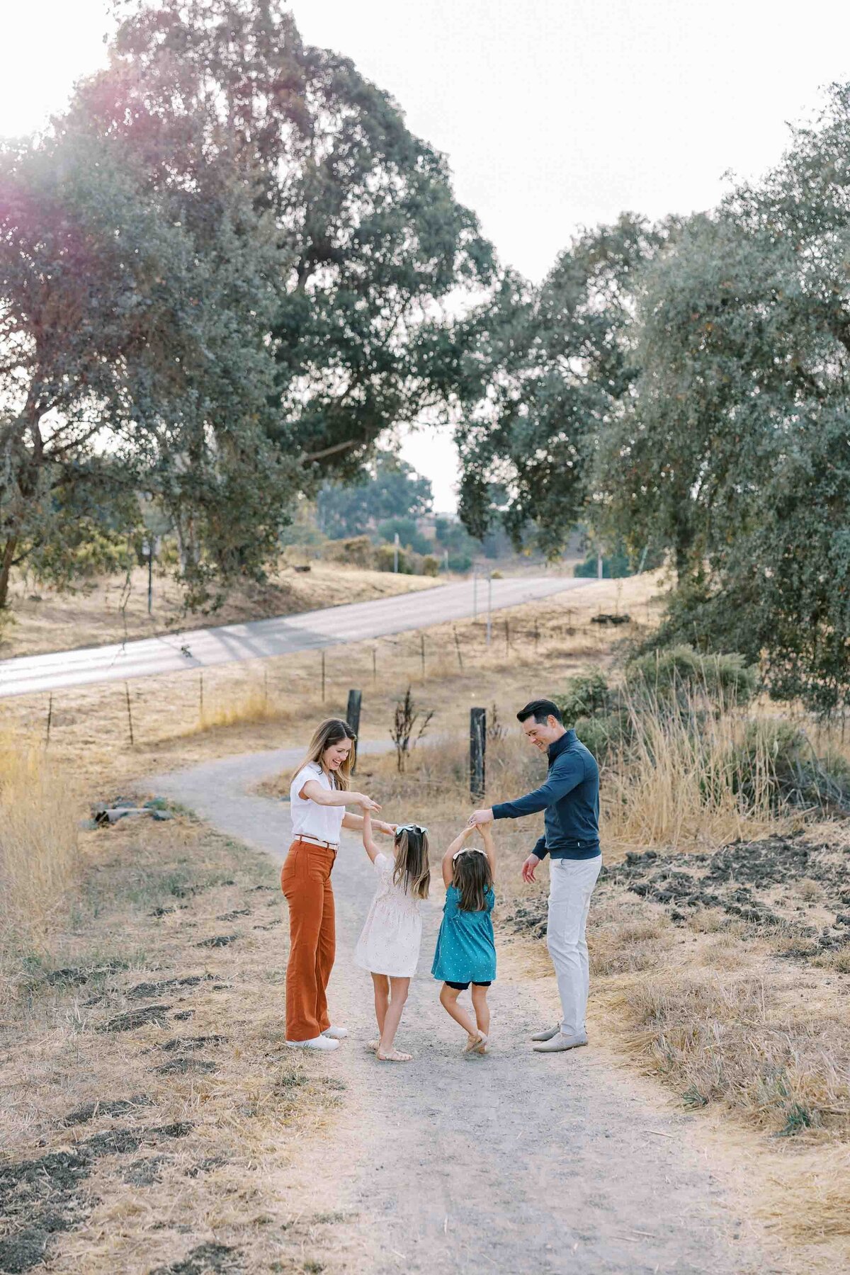 parents twirling their daughters like princesses