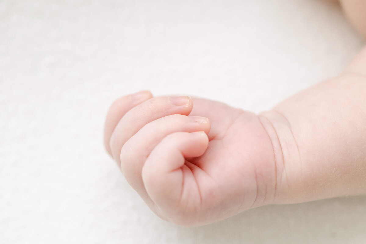 a close up of a newborn's hand