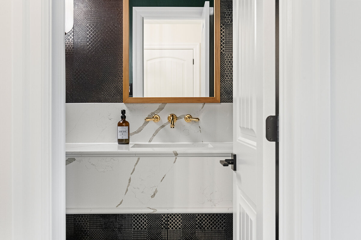 Final image of our moody luxe powder room interior design project.