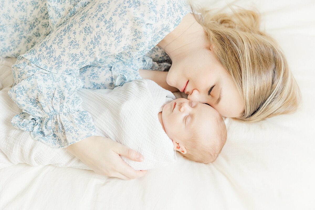 mom and baby during in home newborn photo session in Natick Massachusetts with Sara Sniderman Photography