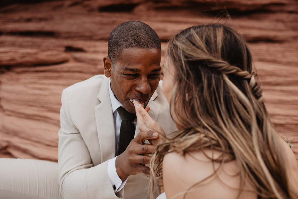 Utah Elopement Photographer captures bride feeding groom cake
