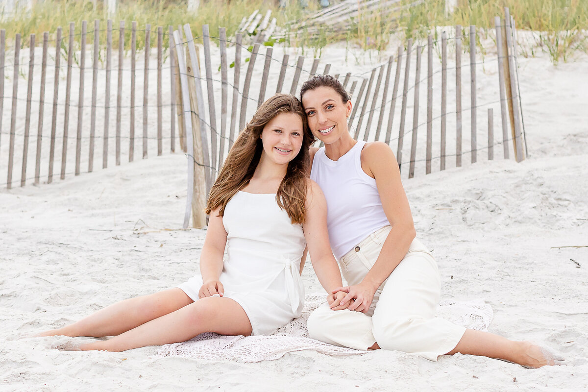 Mom and daughter pose during a family session in Atlantic Beach, Florida