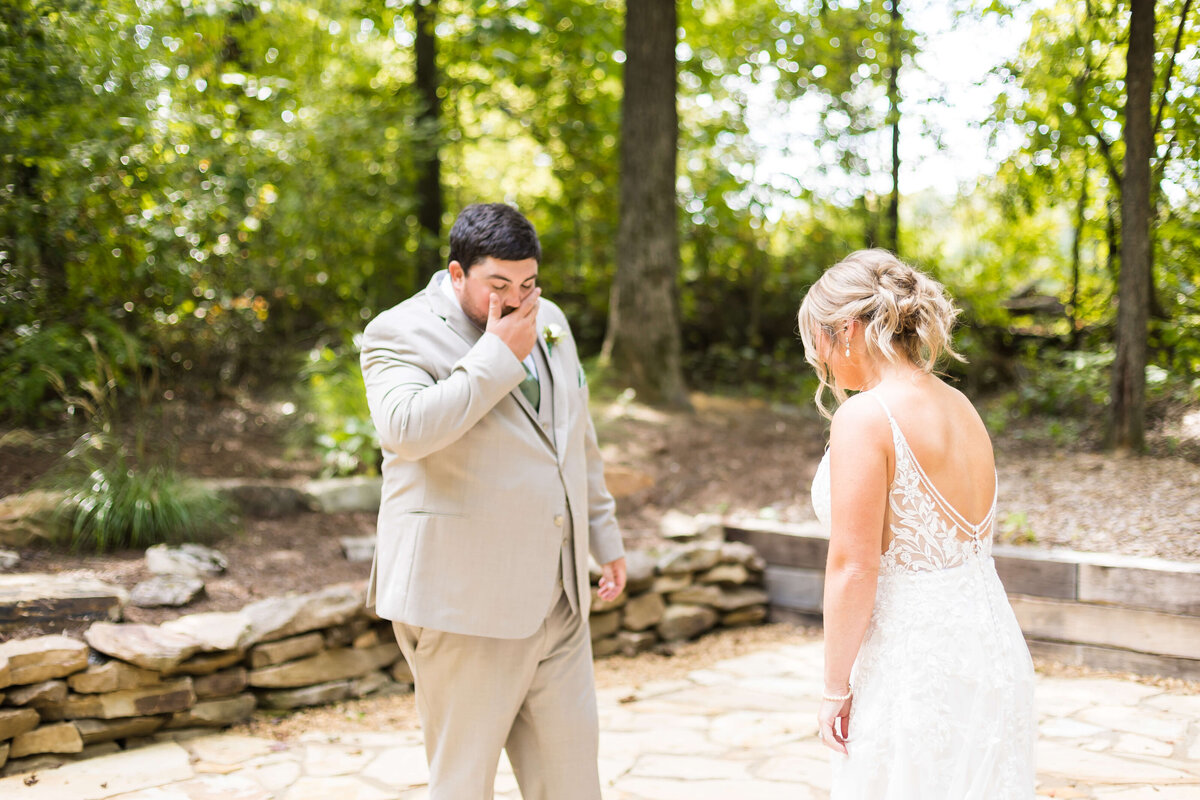 Groom looking at bride at  The Barn at White Oaks, Murray, Kentucky