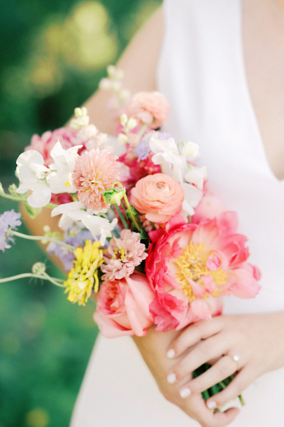 bright springtime bridal bouquet by caroline james floral at ladybird johnson wildflower center in austin texas by austin wedding photographer