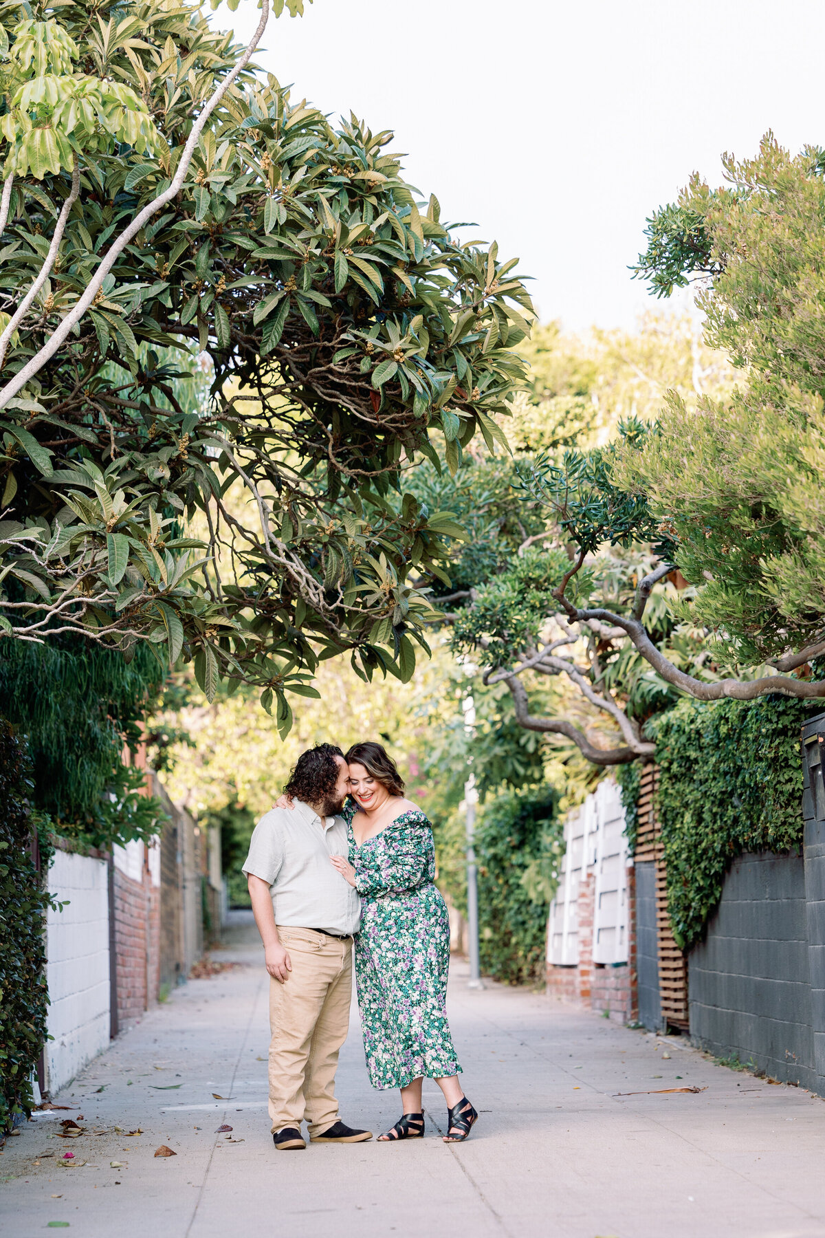 A person resting their head on their partner's forehead