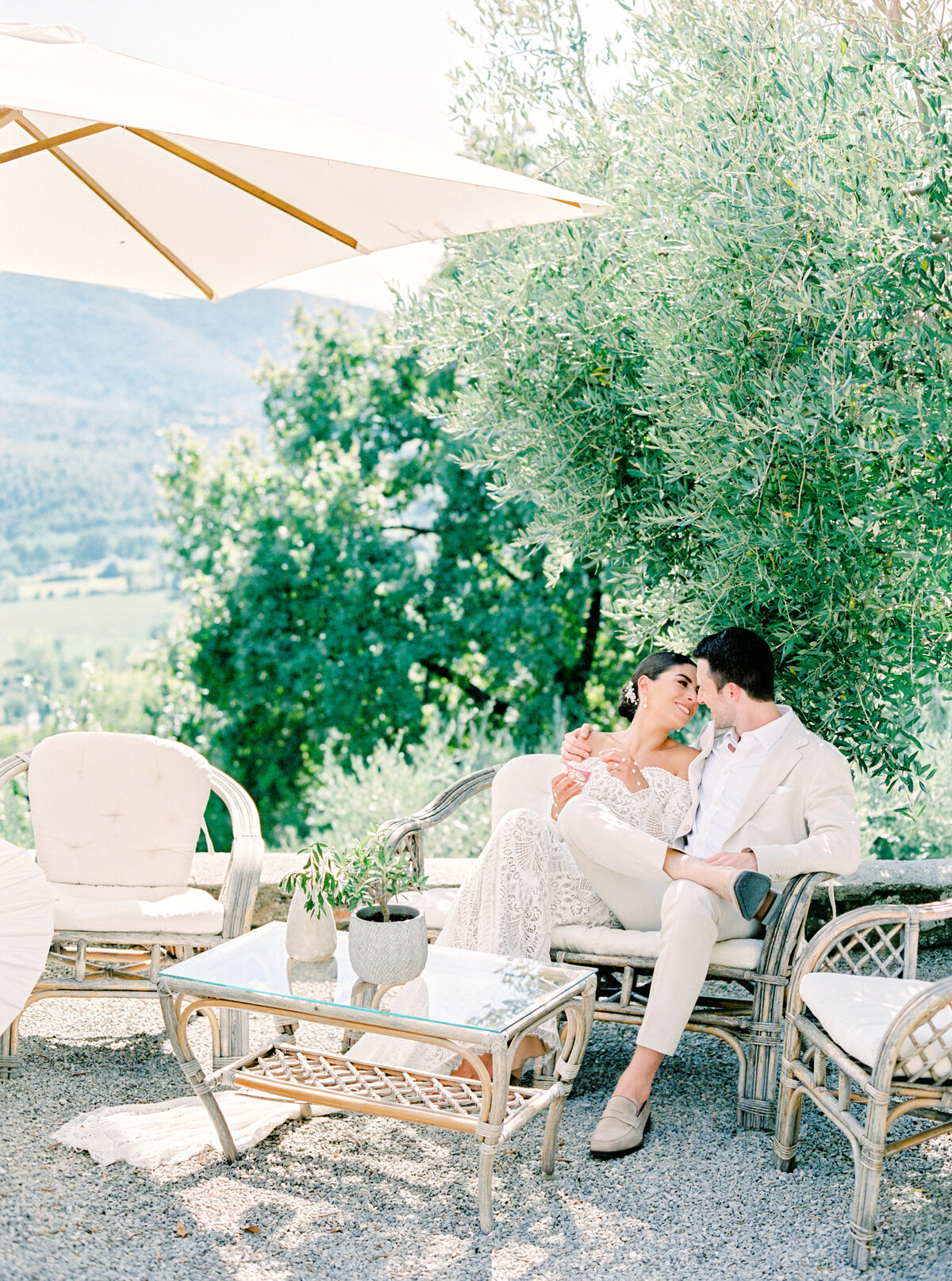 Film photograph of Bride and groom eating gelato photographed by Italy wedding photographer at Villa Montanare Tuscany wedding