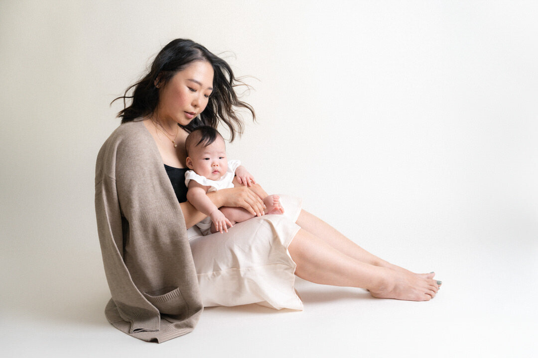 mom with baby portrait flowing hair in studio