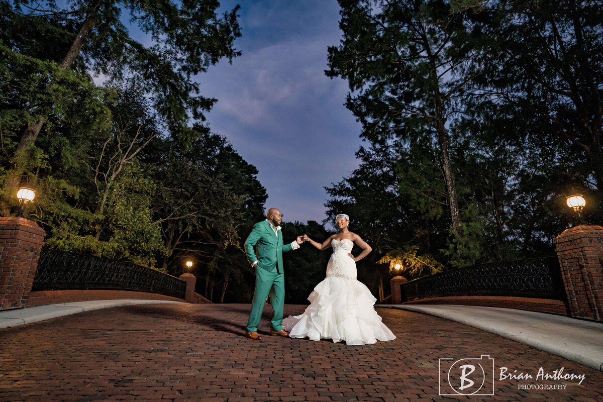 Newlyweds sharing a magical dance under the evening sky at their wedding venue.