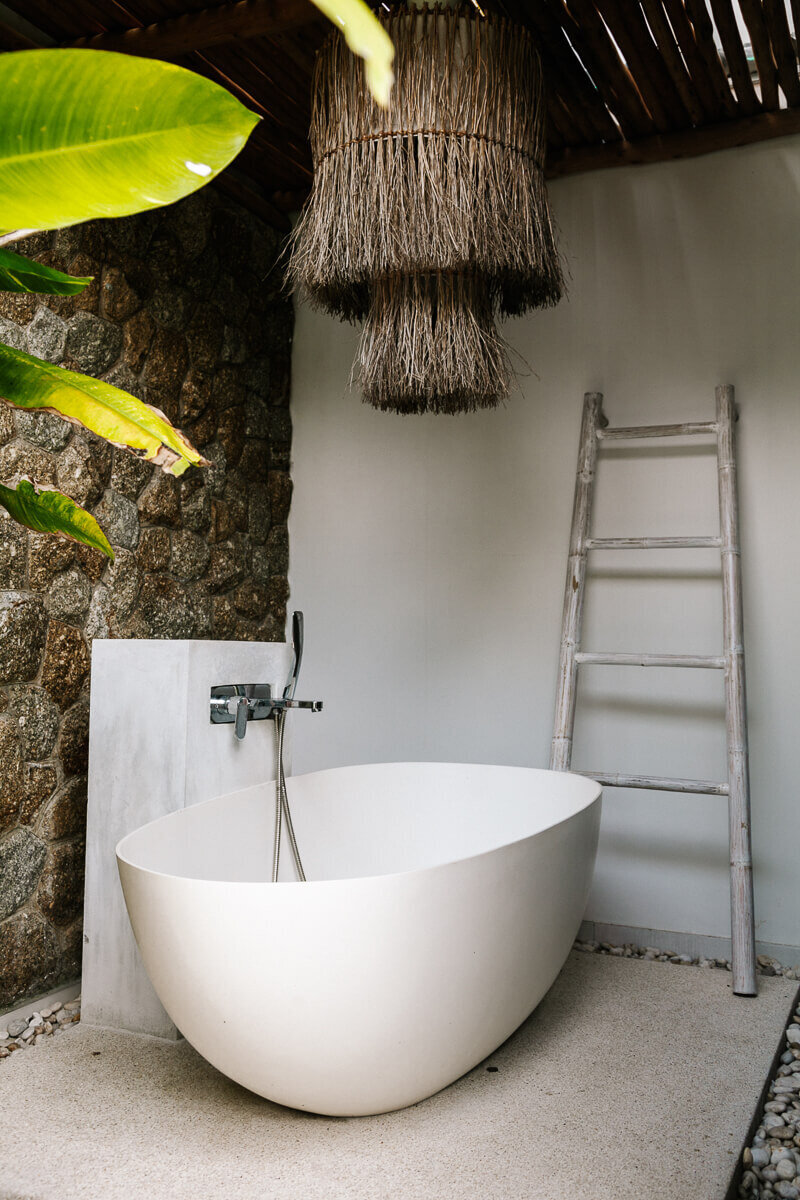 Bathtub in Casa Orientale. a beautiful Balinese-style villa, surrounded by lush vegetation, near Mae Nam in Koh Samui Thailand.
