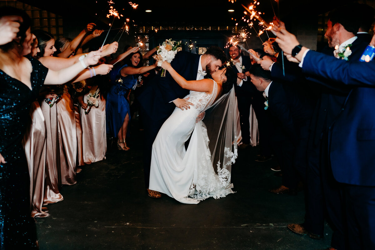 sparkler exit of bride and groom kissing after wedding in Delcambre, la