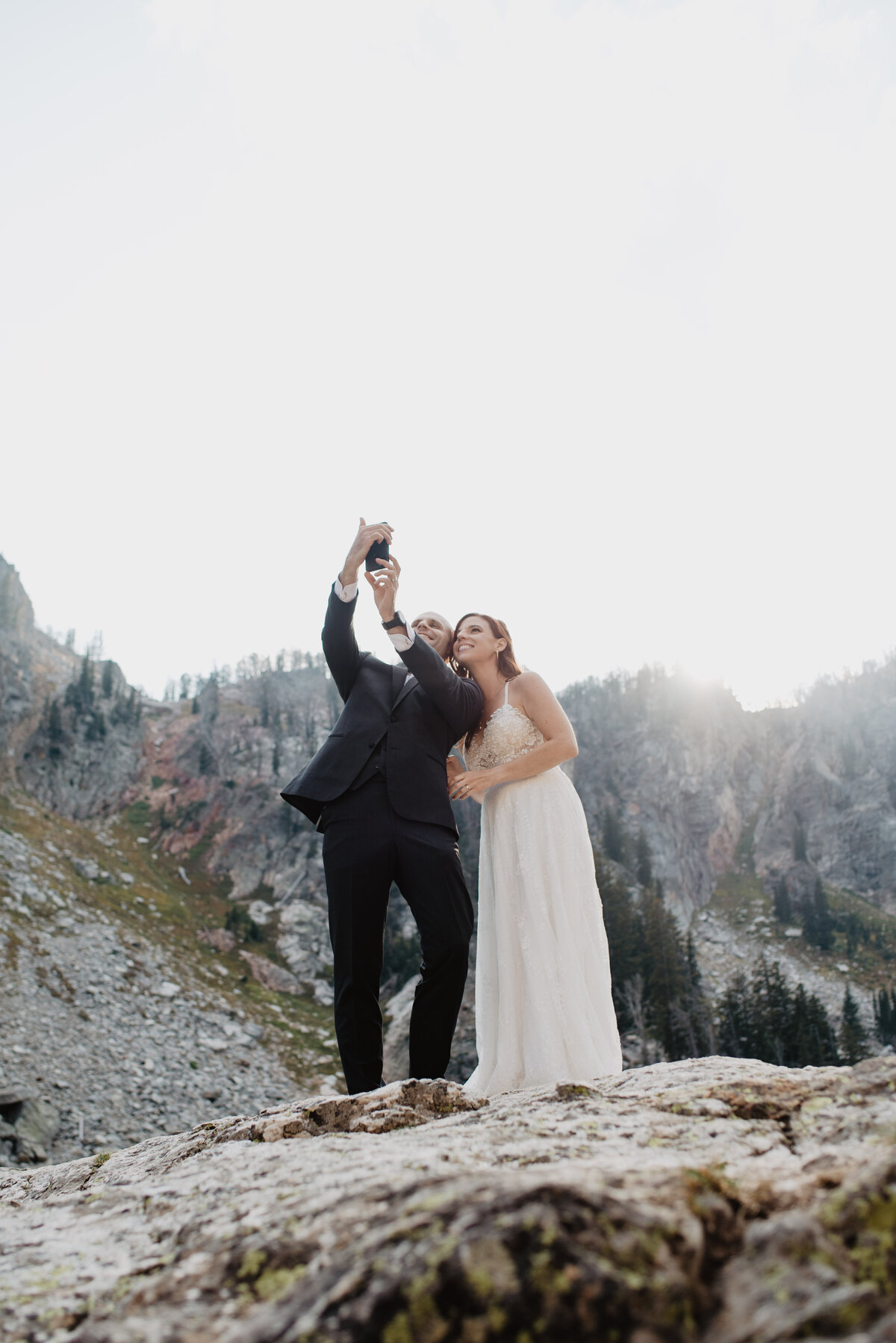 Jackson Hole photographers capture bride and groom facetiming family