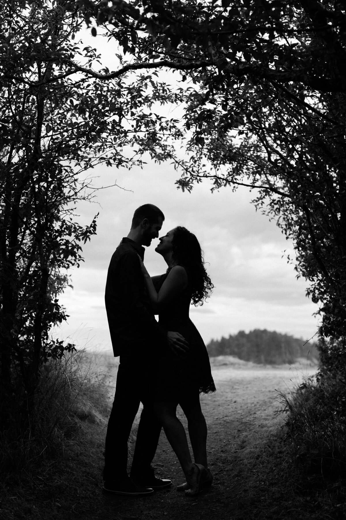 Black and white silhouette engagement photos at Deception Pass near Seattle romantic dramatic photo by Joanna Monger Photography