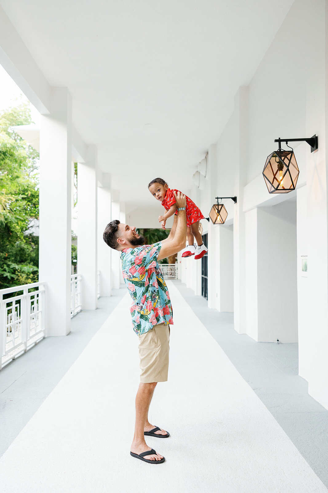 A father and son share a casual yet stylish portrait moment during a Florida Keys family photography session.