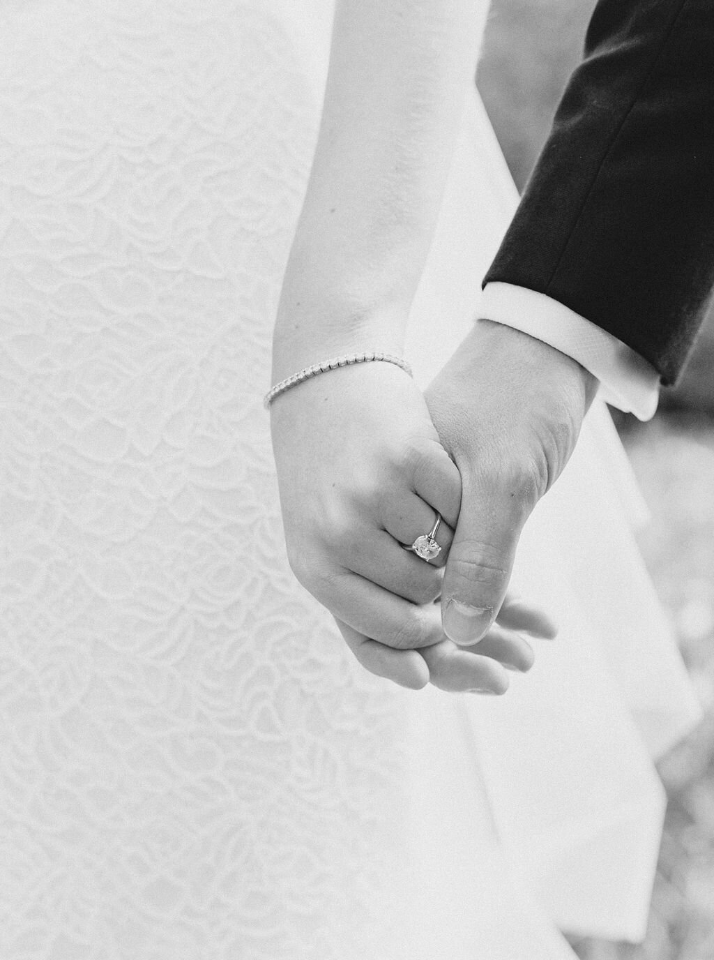 bride-and-groom-holding-hands