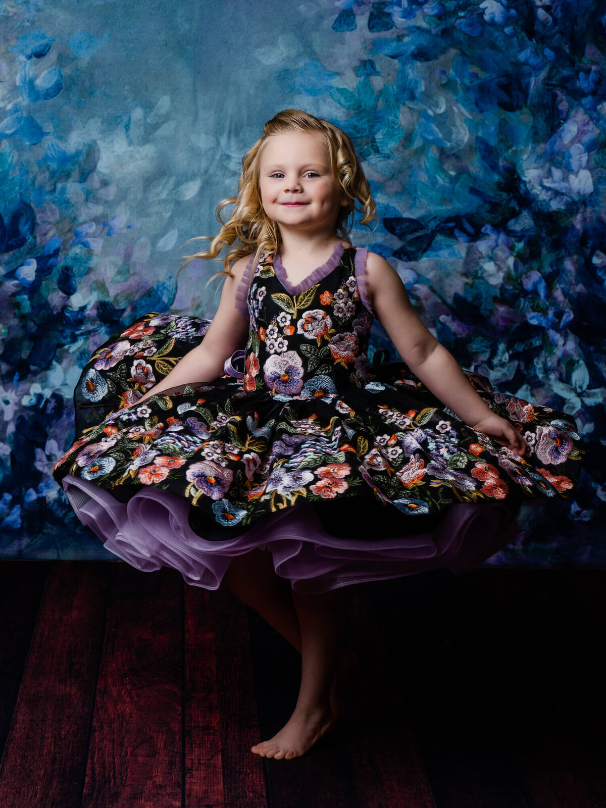 Young girl spins in dream dress in Prescott kids photography session by Melissa Byrne