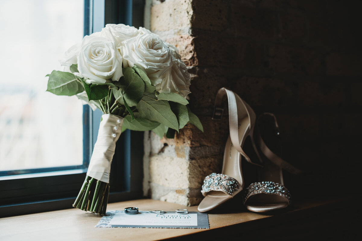 Wedding Day shoes and flowers in front of window
