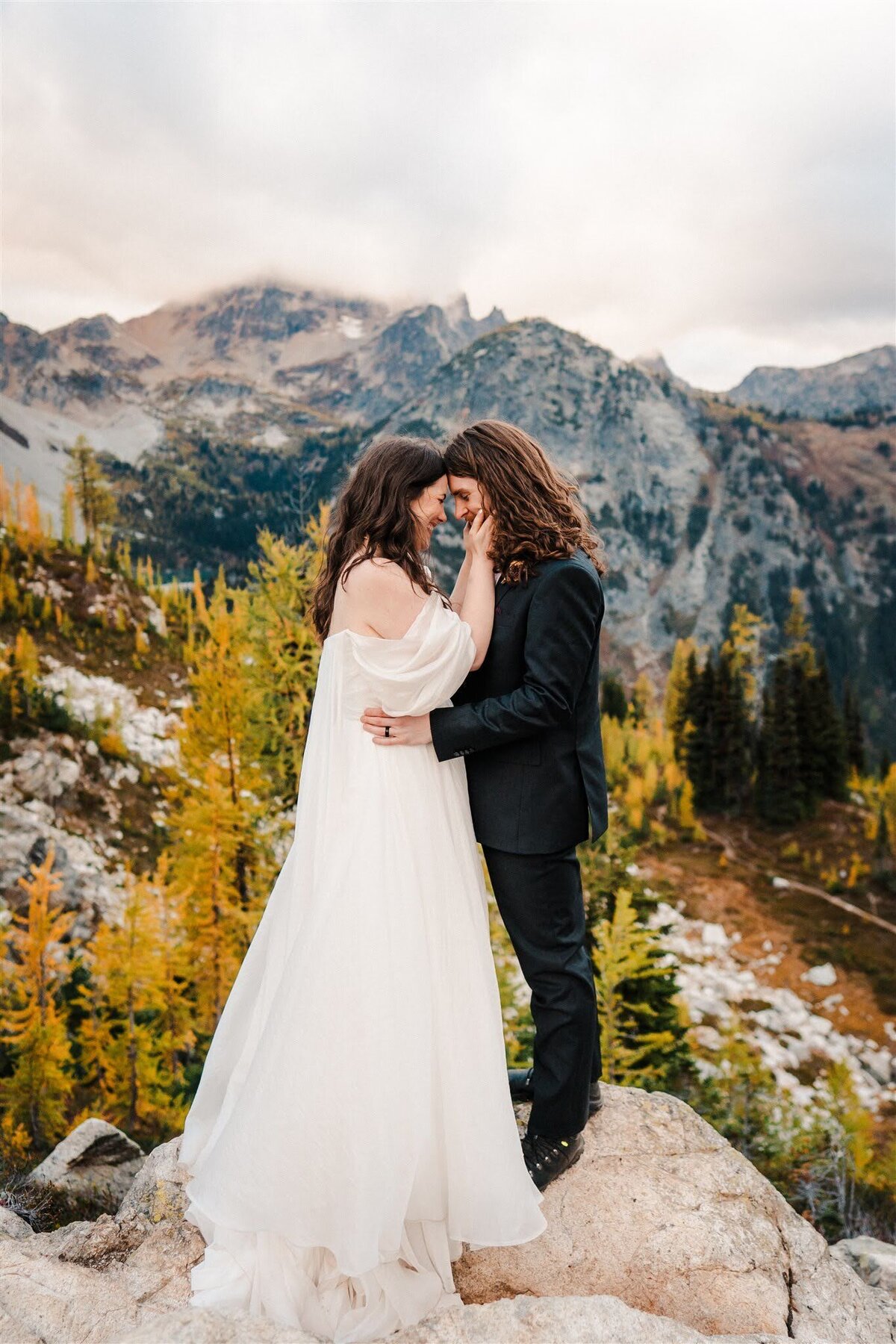 Bride & groom touching foreheads along larch-lined Maple Pass Loop in the North Cascades!