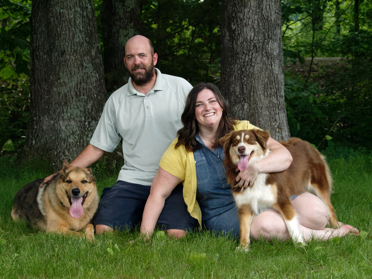 husband and wife with dogs outdoor daytime portrait